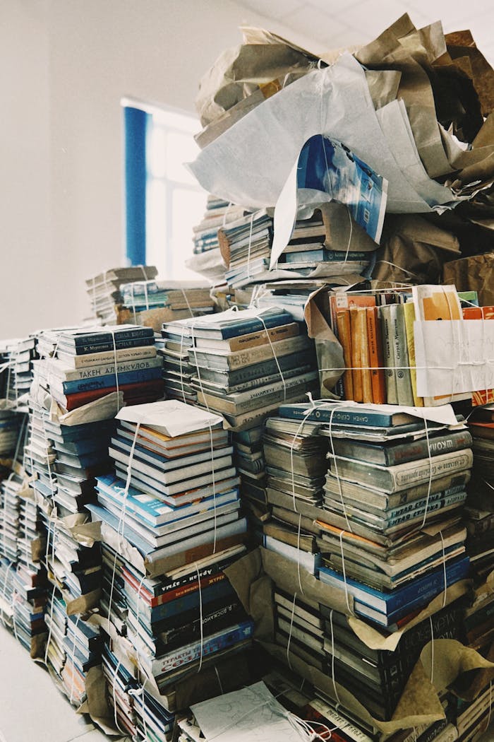 Stacks of bundled books organized in a library room in Talgar, Kazakhstan.
